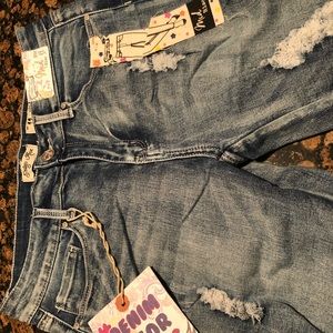 NWT mid rise distressed jeans
